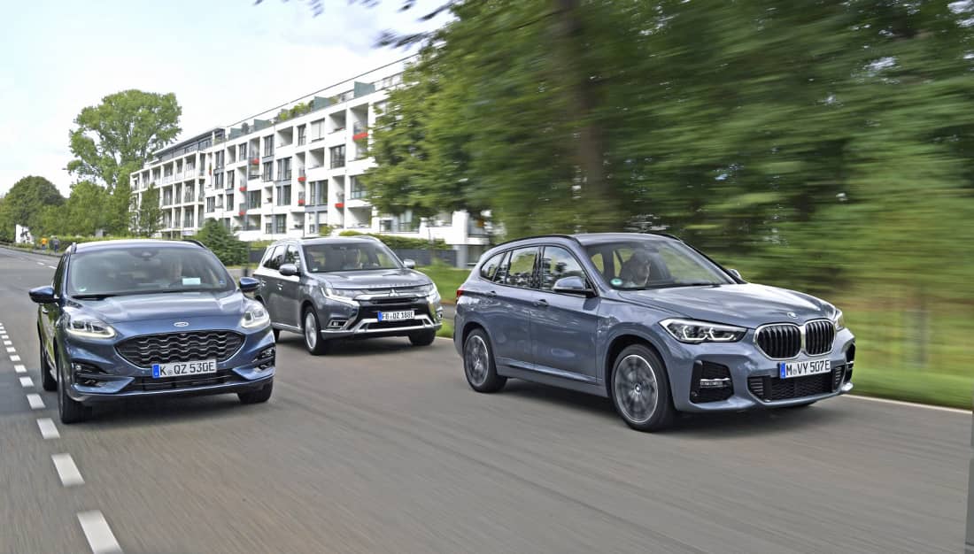 Welke hybride suv met stekker is het zuinigst? BMW X1, Ford Kuga of Mitsubishi Outlander