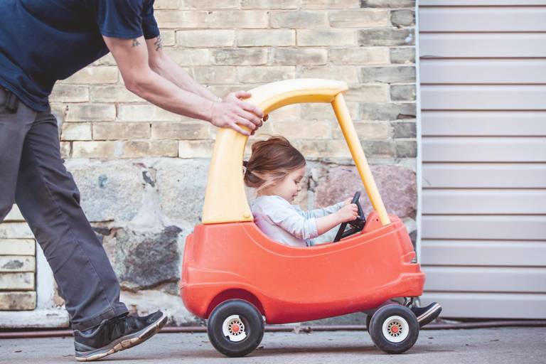 family, children, child in a small toy car, toddler girl being pushed by her father